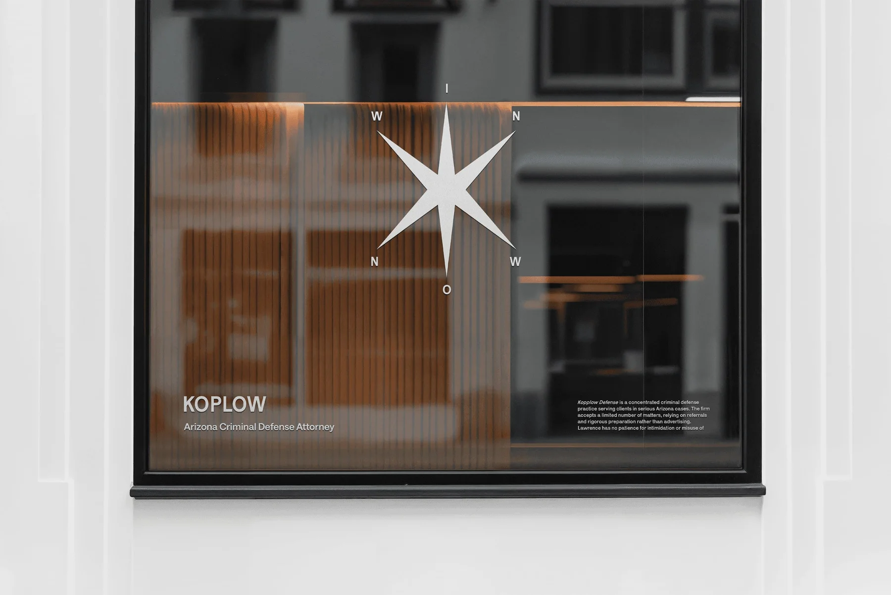 Koplow Defense window lettering and a large white star.