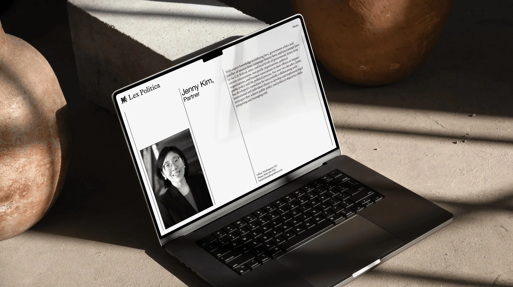 Lex Politica desktop website displayed on a laptop.