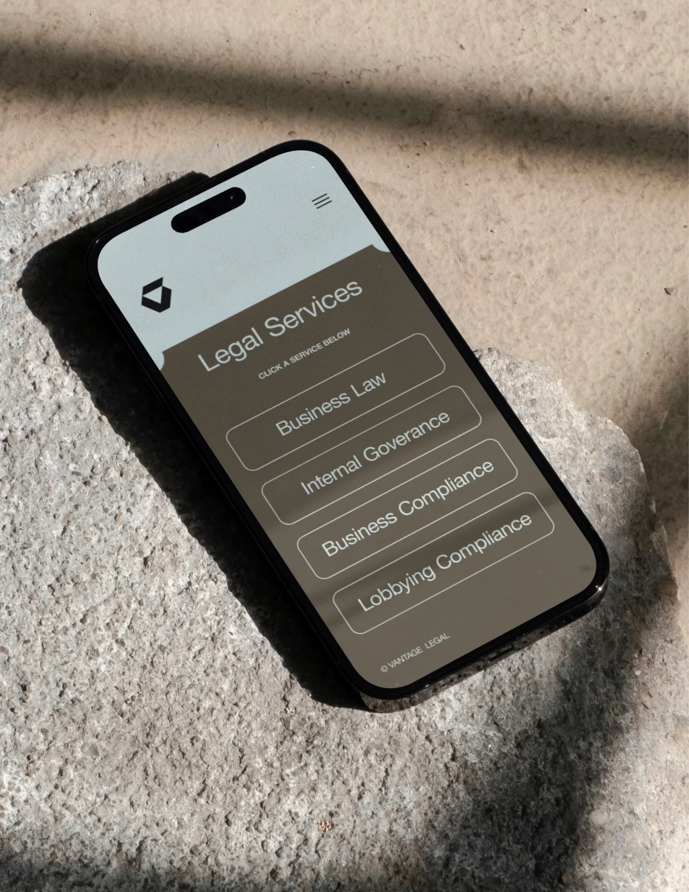 Vantage mobile website on a phone resting on fabric.