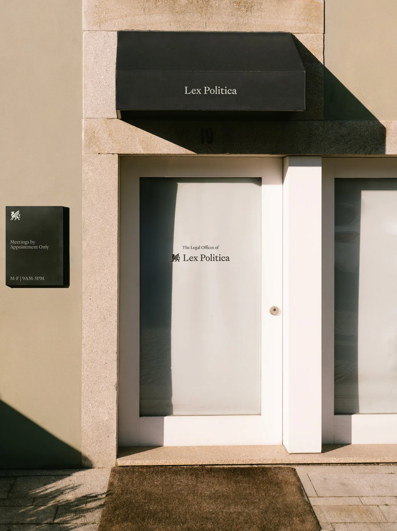 Lex Politica signage on an office entrance and awning.