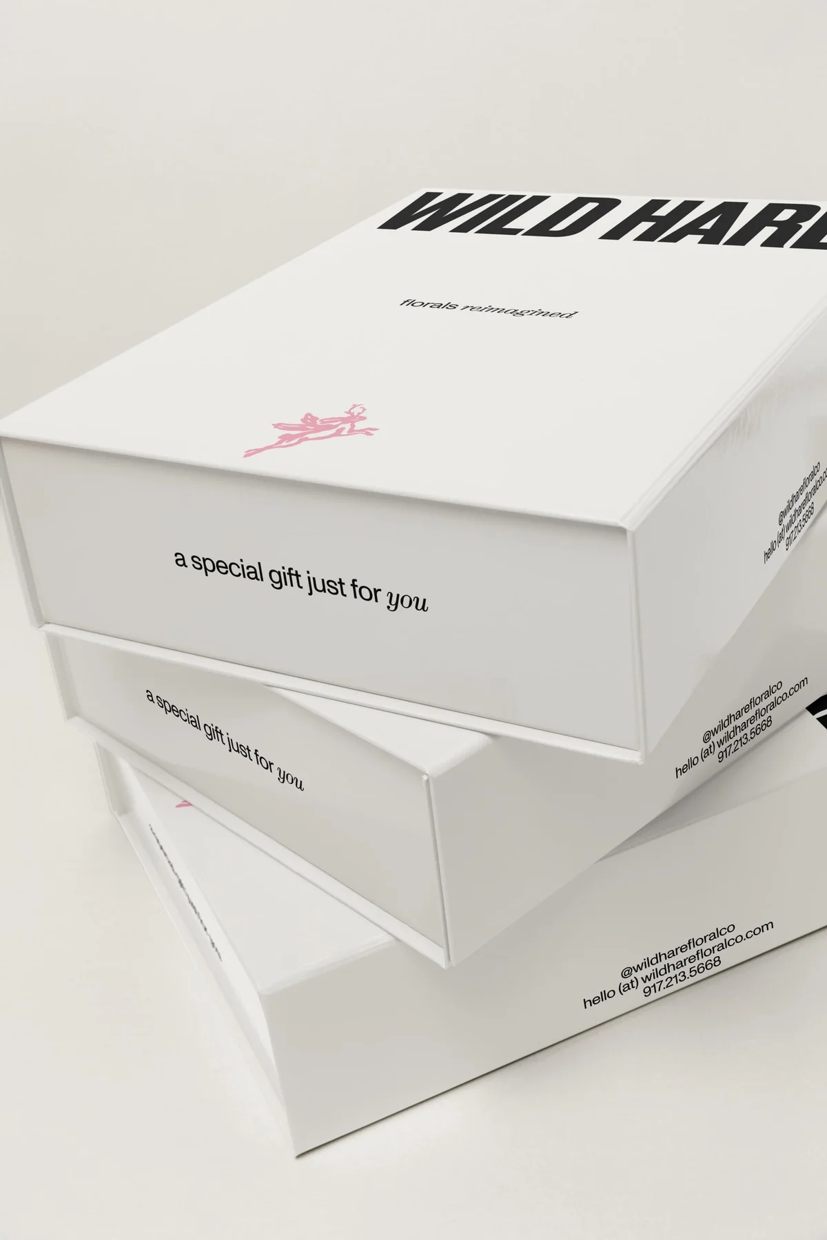 Stacked white Wild Hare boxes with black lettering.