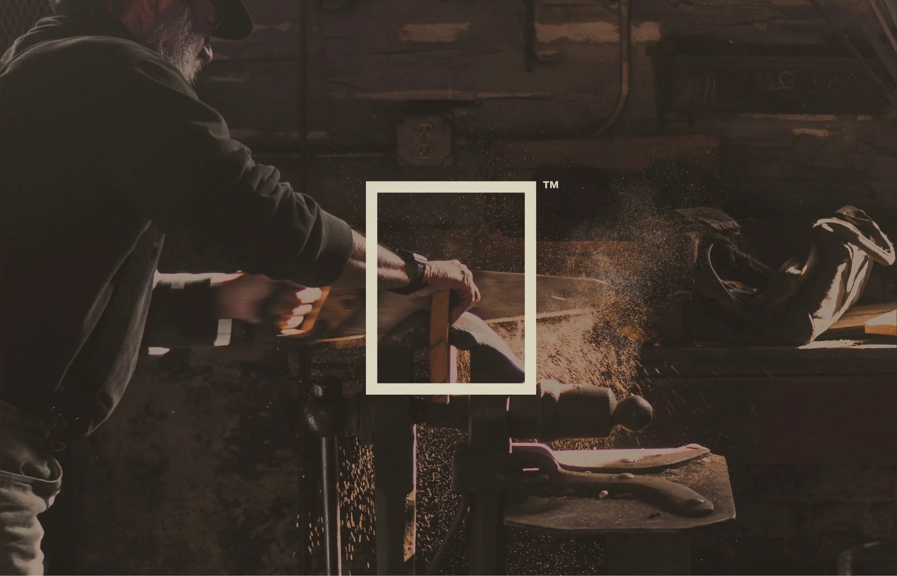 Woodworker in a workshop with the Museum frame emblem overlaid.