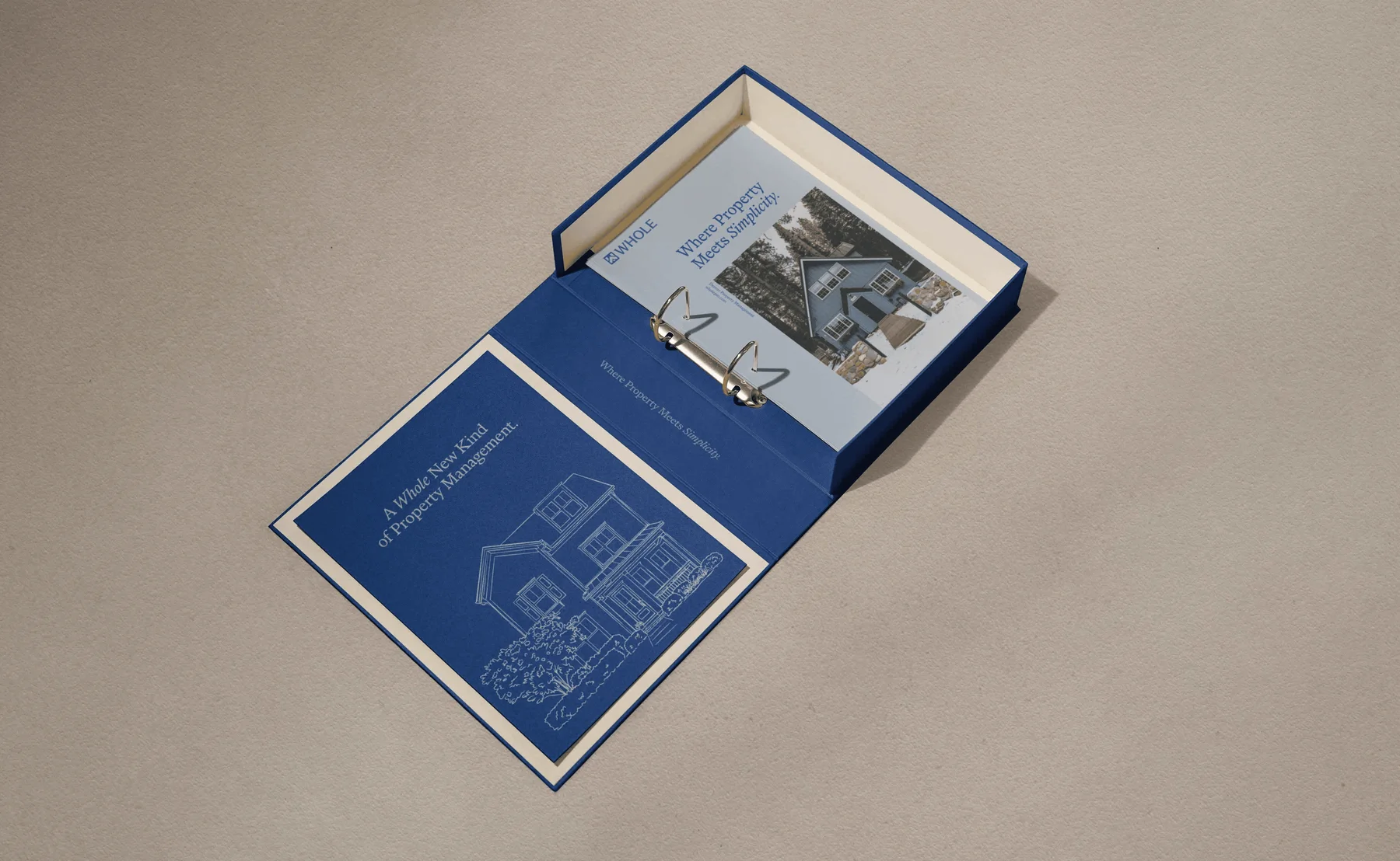 Open Whole folder with architectural drawings and printed pages.