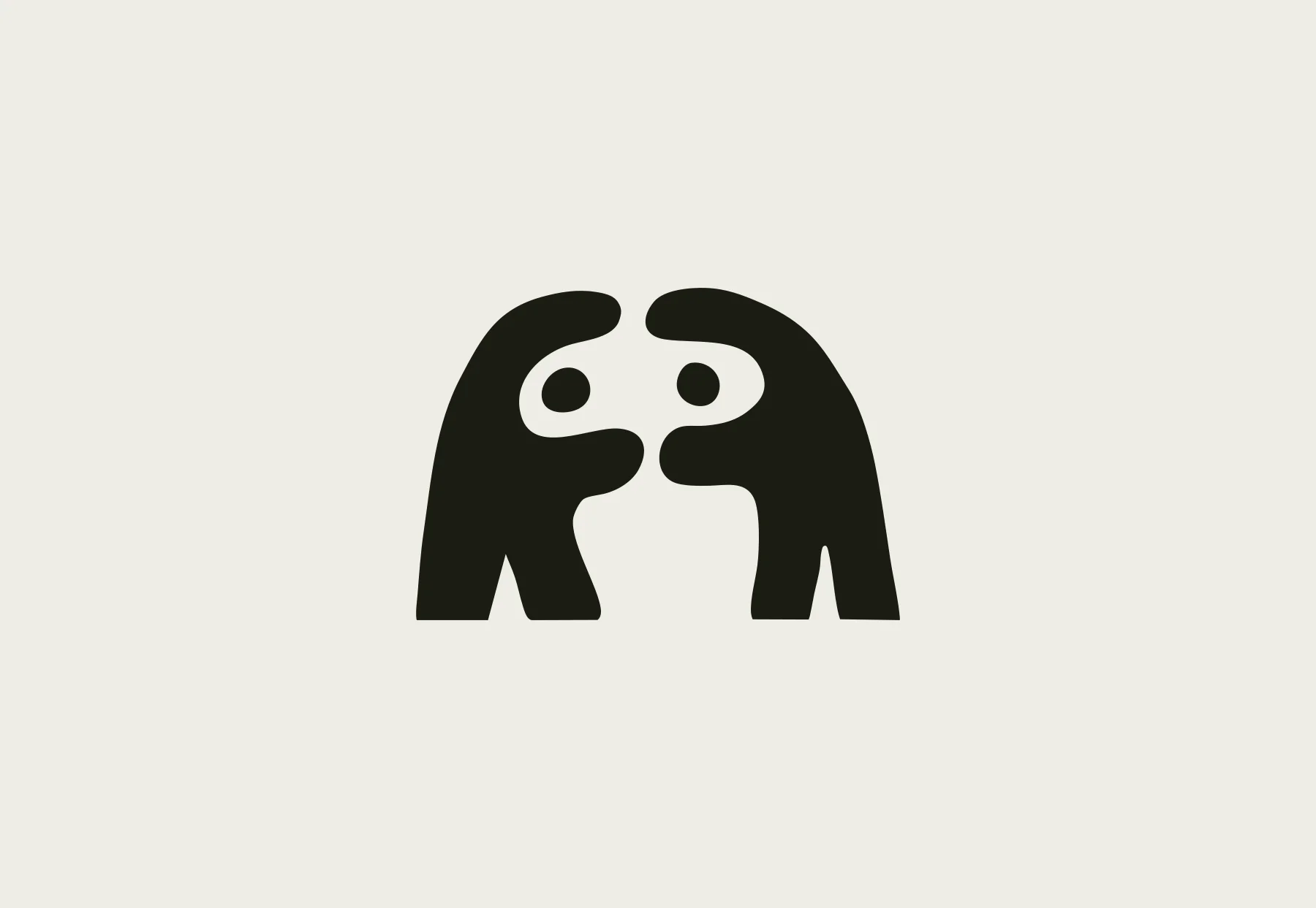 Black illustration of two facing bears on cream.