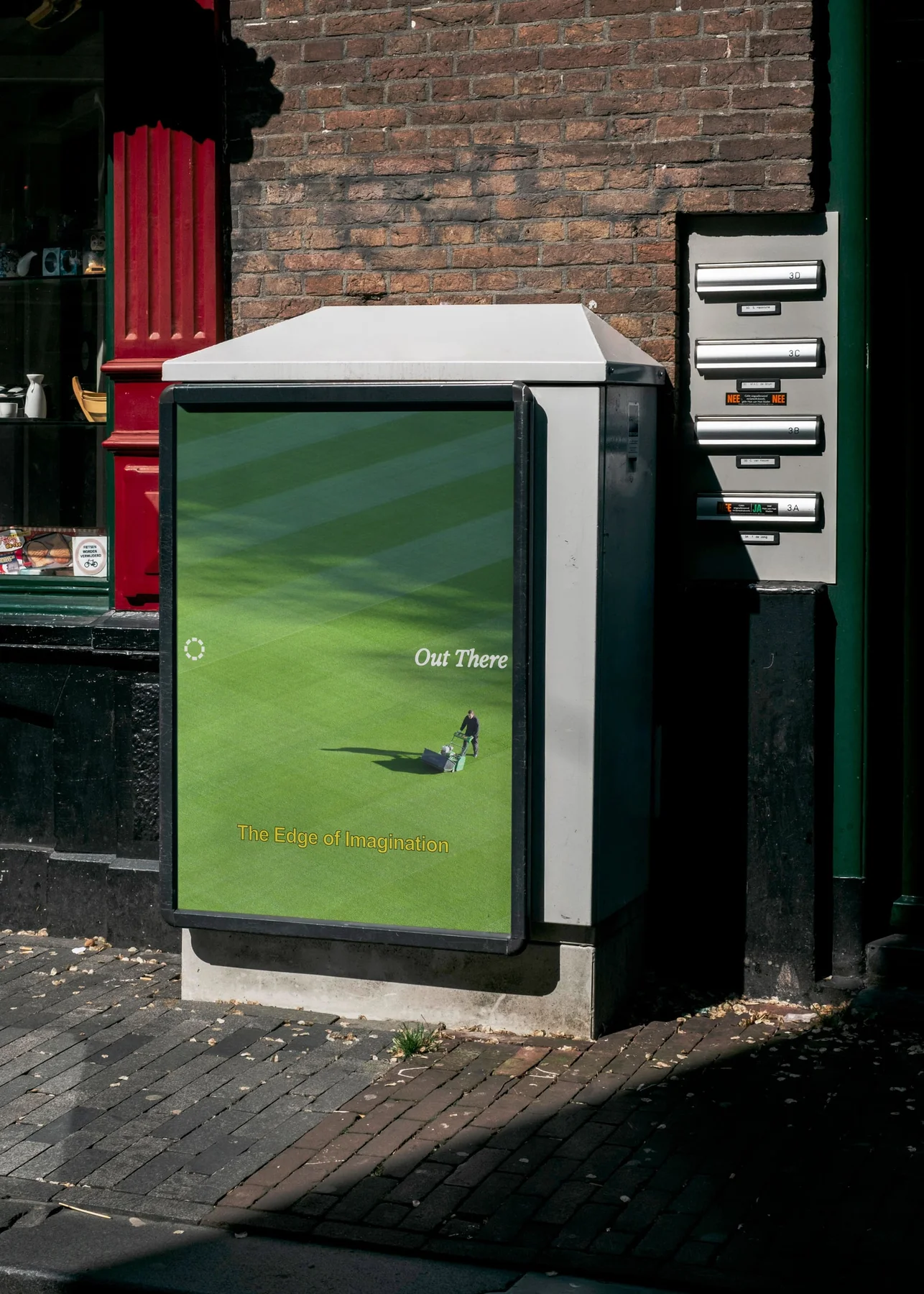 Out There street poster featuring a green field.
