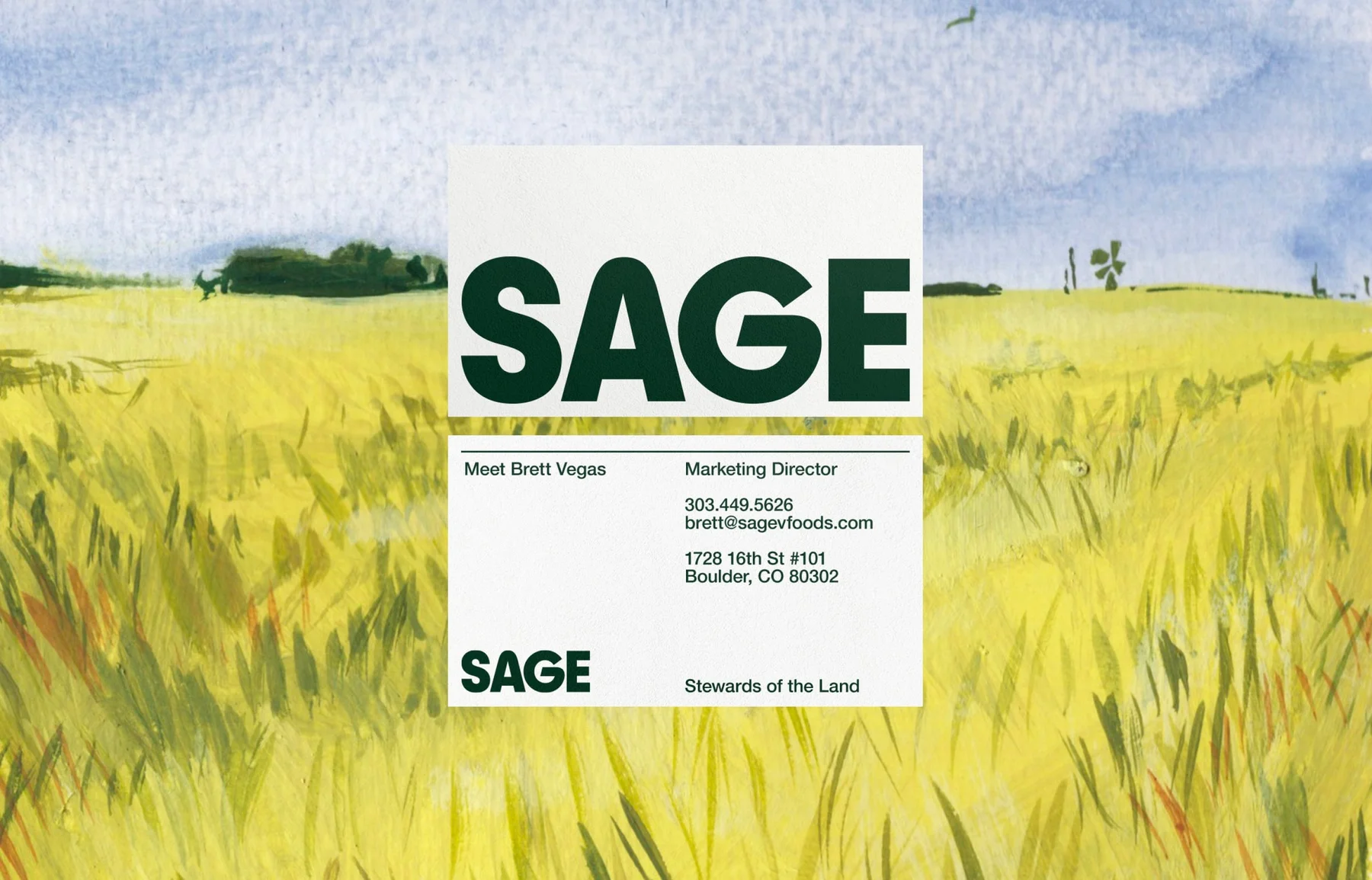 Sage business cards over a painted field landscape.