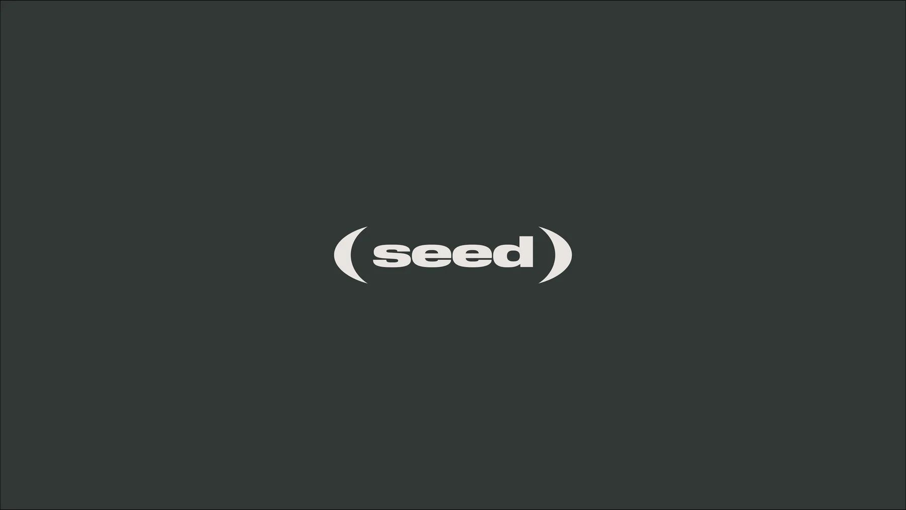 White Seed wordmark enclosed in parentheses on dark green-gray.