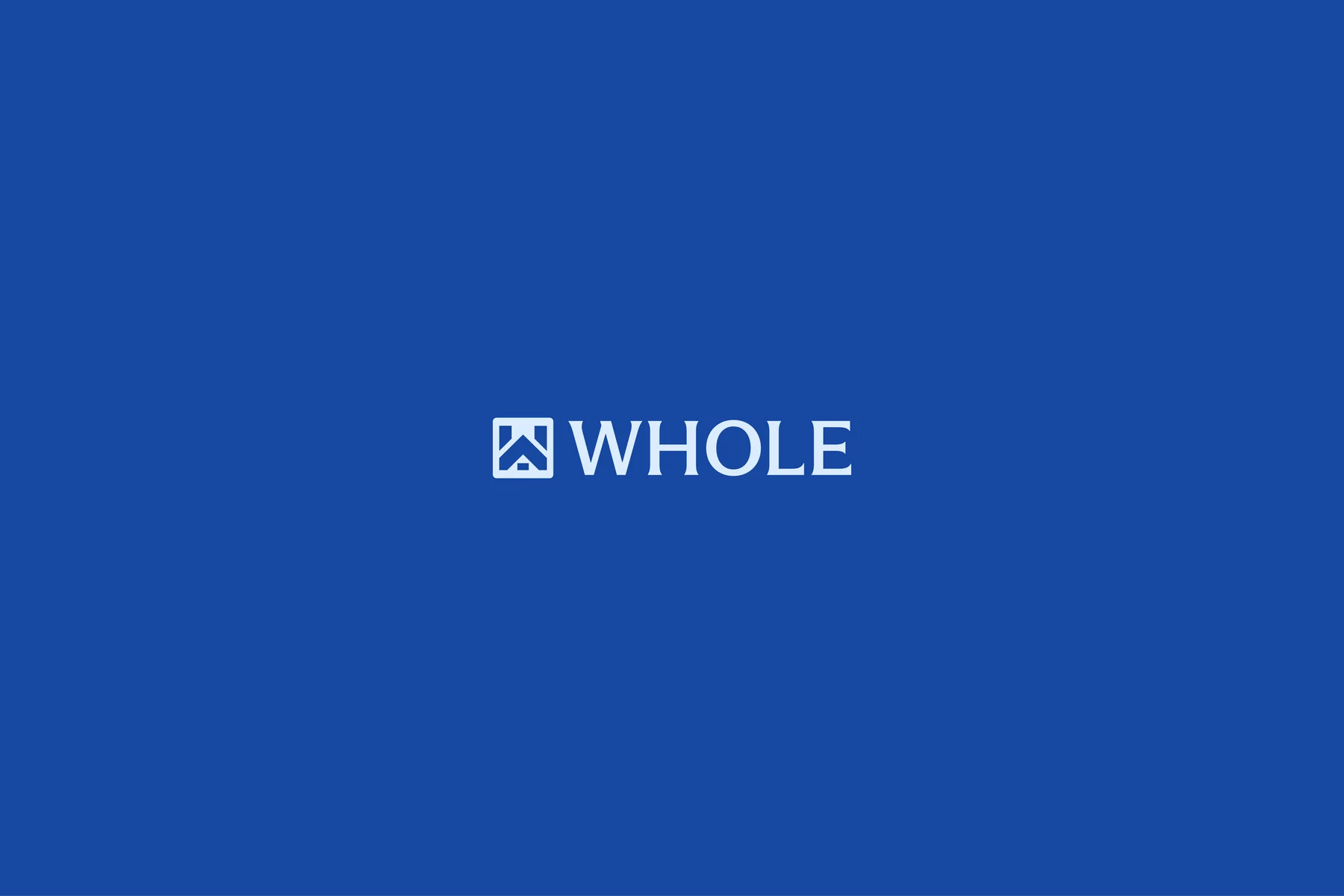 White Whole wordmark and geometric house emblem on blue.