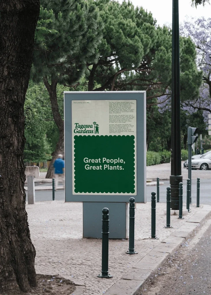 Tagawa Gardens green street poster framed by trees.