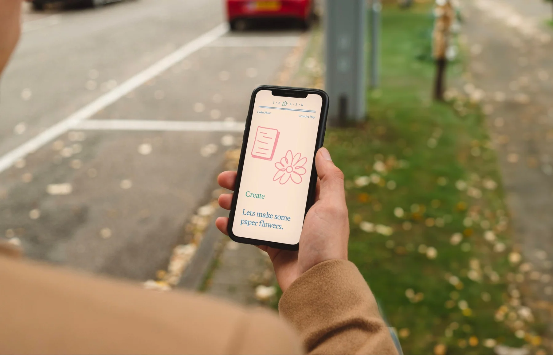 Nylo mobile website shown on a phone outdoors.