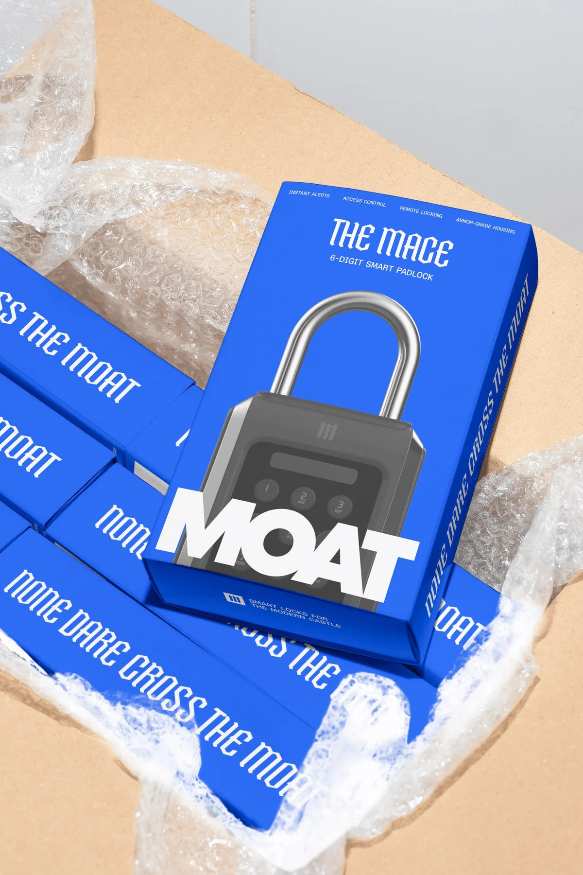 Moat smart-lock packaging in a cardboard shipping box with white packing material.