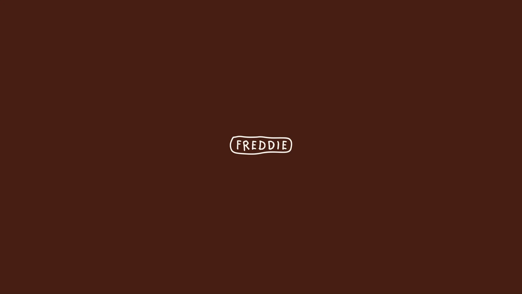 Small cream Freddie wordmark on a dark brown background.