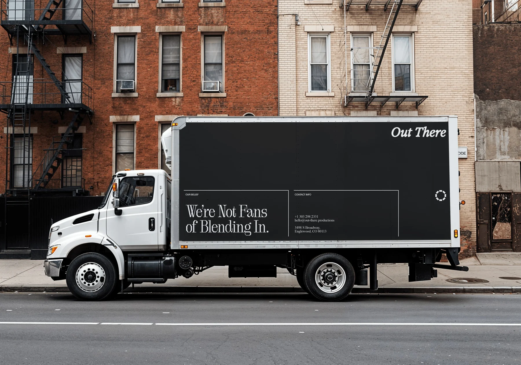 Black Out There delivery truck with white lettering.