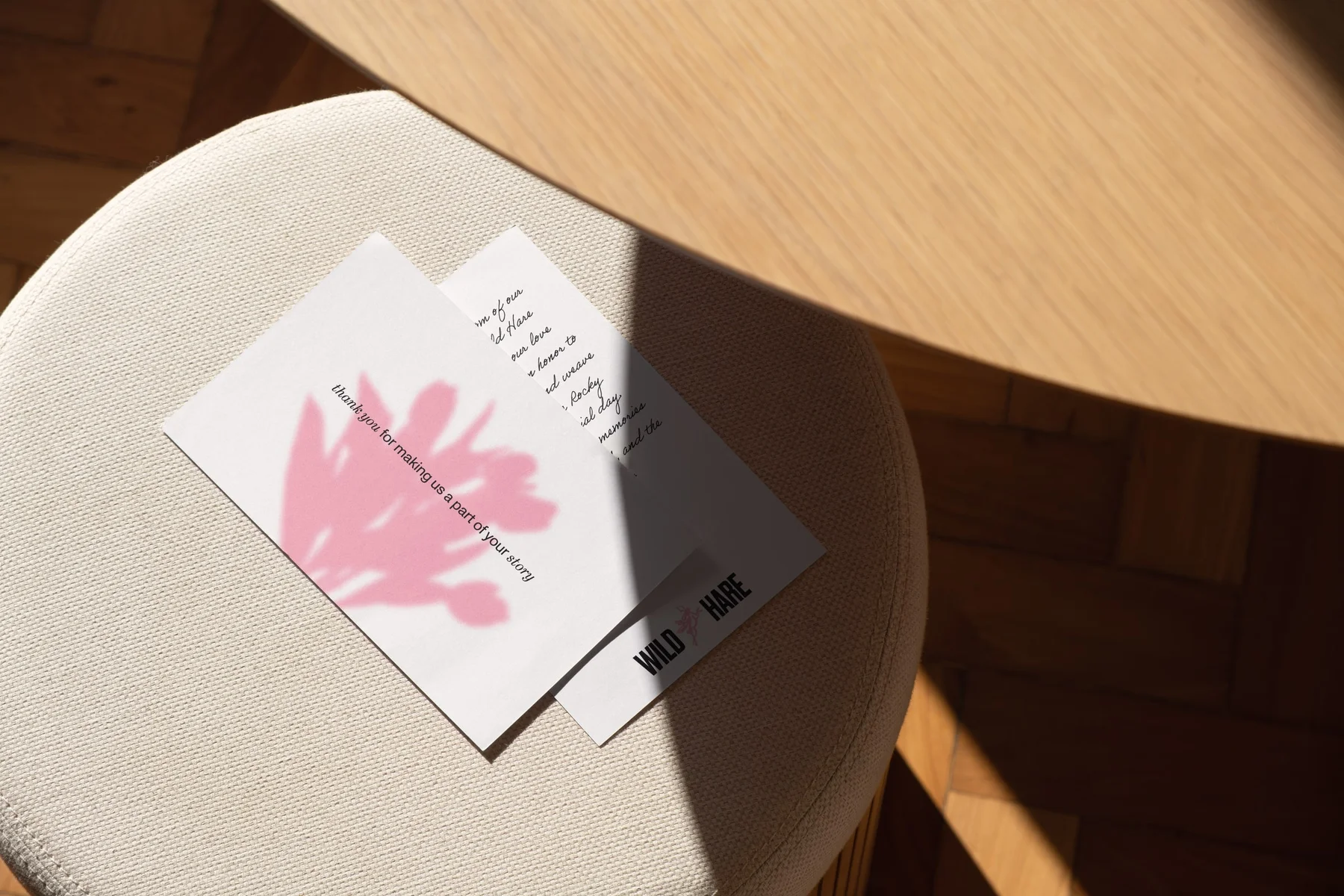Wild Hare printed card with an oversized pink hare on a chair.