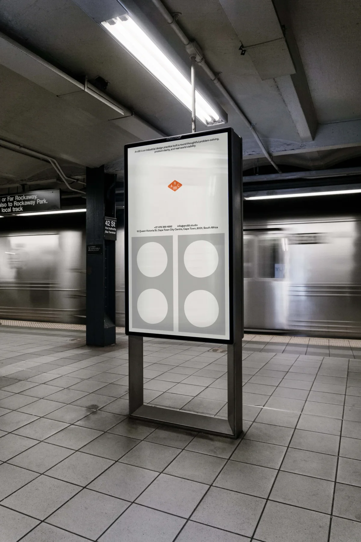 Arc 88 poster with four circles displayed in a subway station.