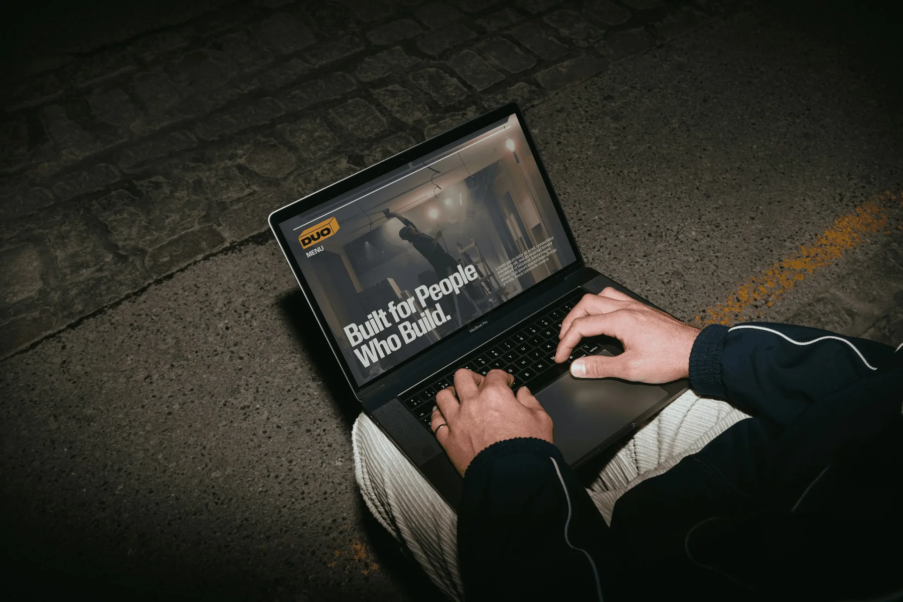 Duo website displayed on a laptop in a person's lap.