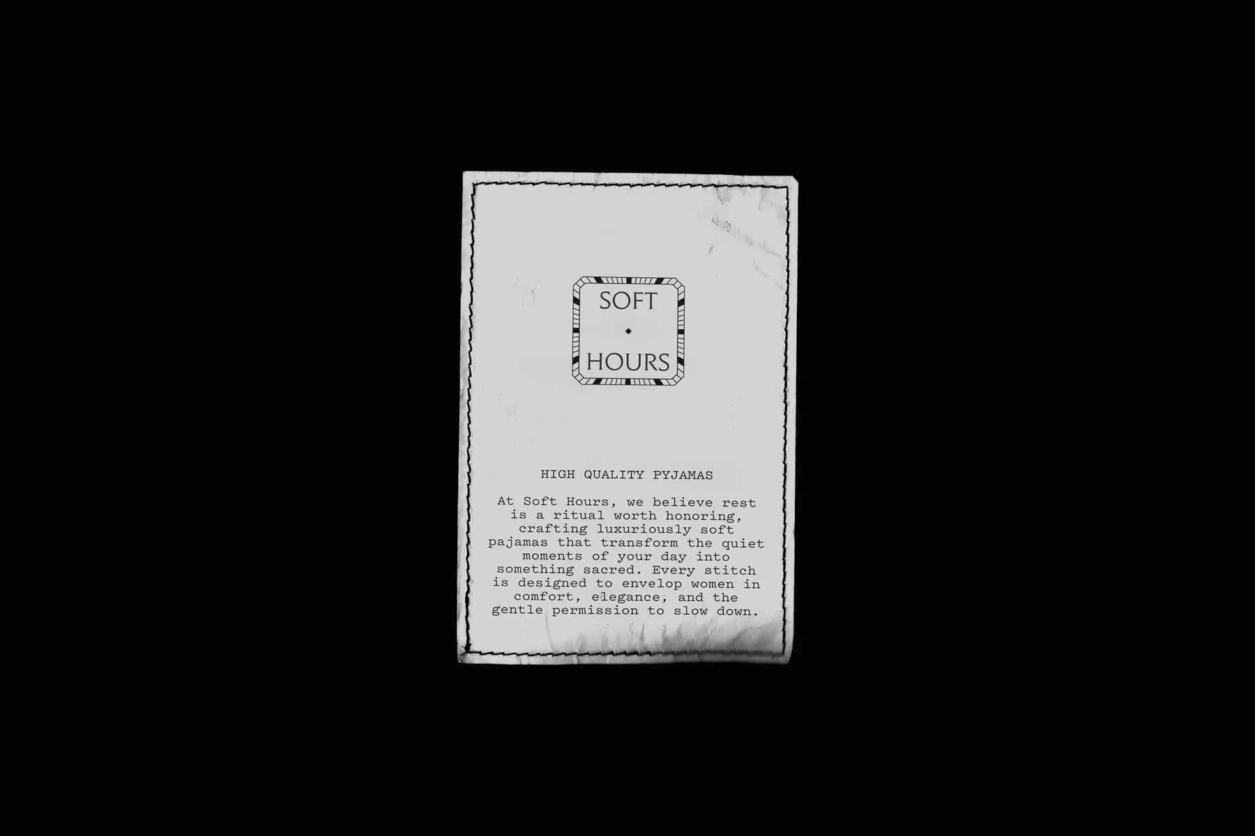 Soft Hours fabric label with a stitched border and small typography.