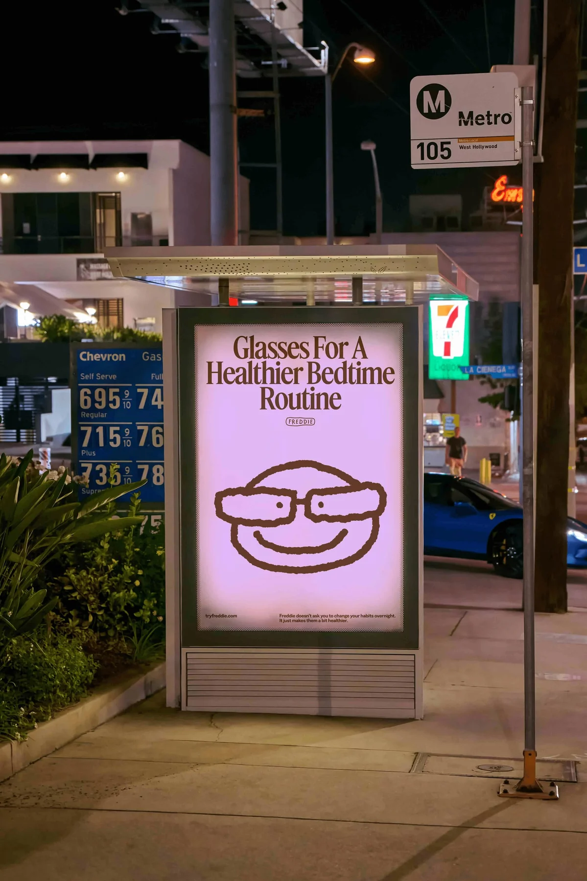 Pink Freddie advertising poster at a bus shelter.