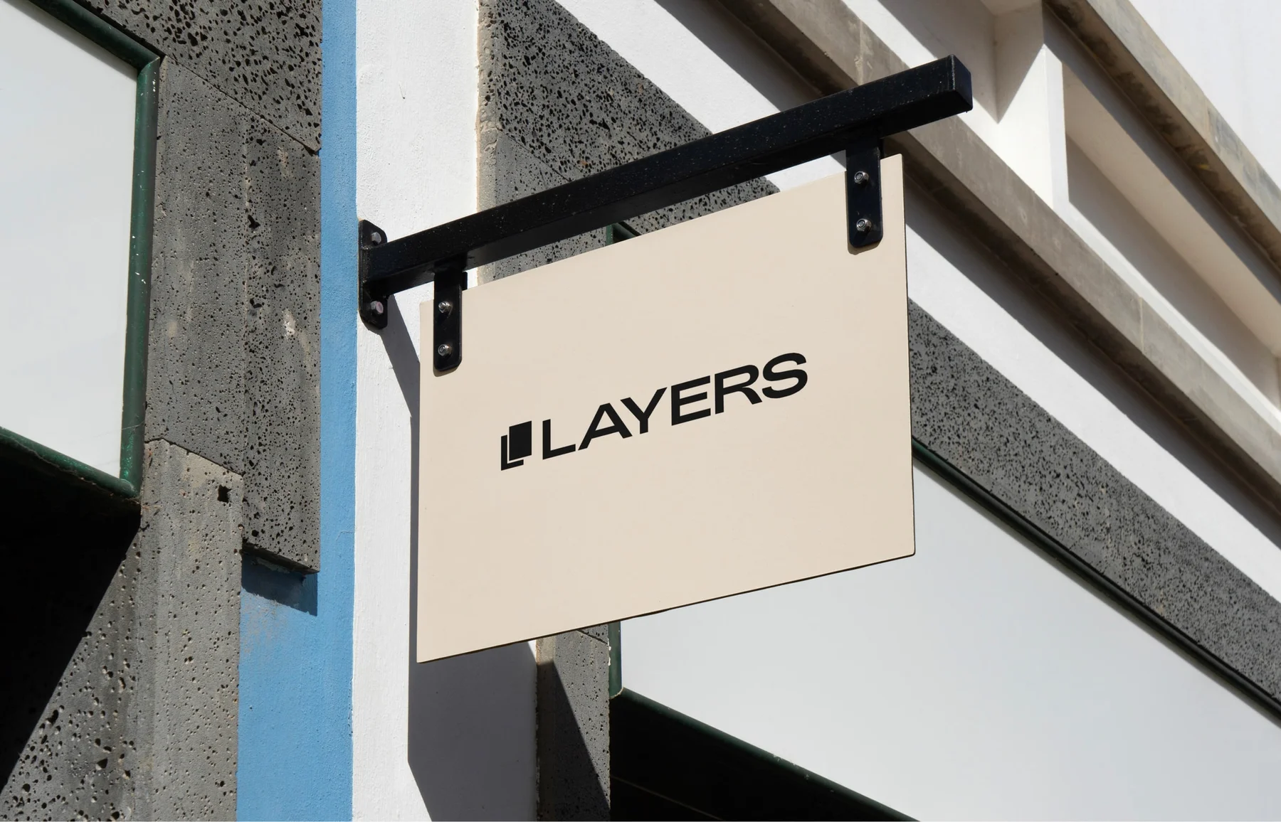 Cream Layers sign projecting from a building.