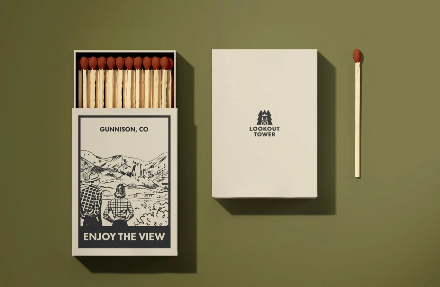 Lookout Tower matchbox with a landscape illustration beside a loose match.
