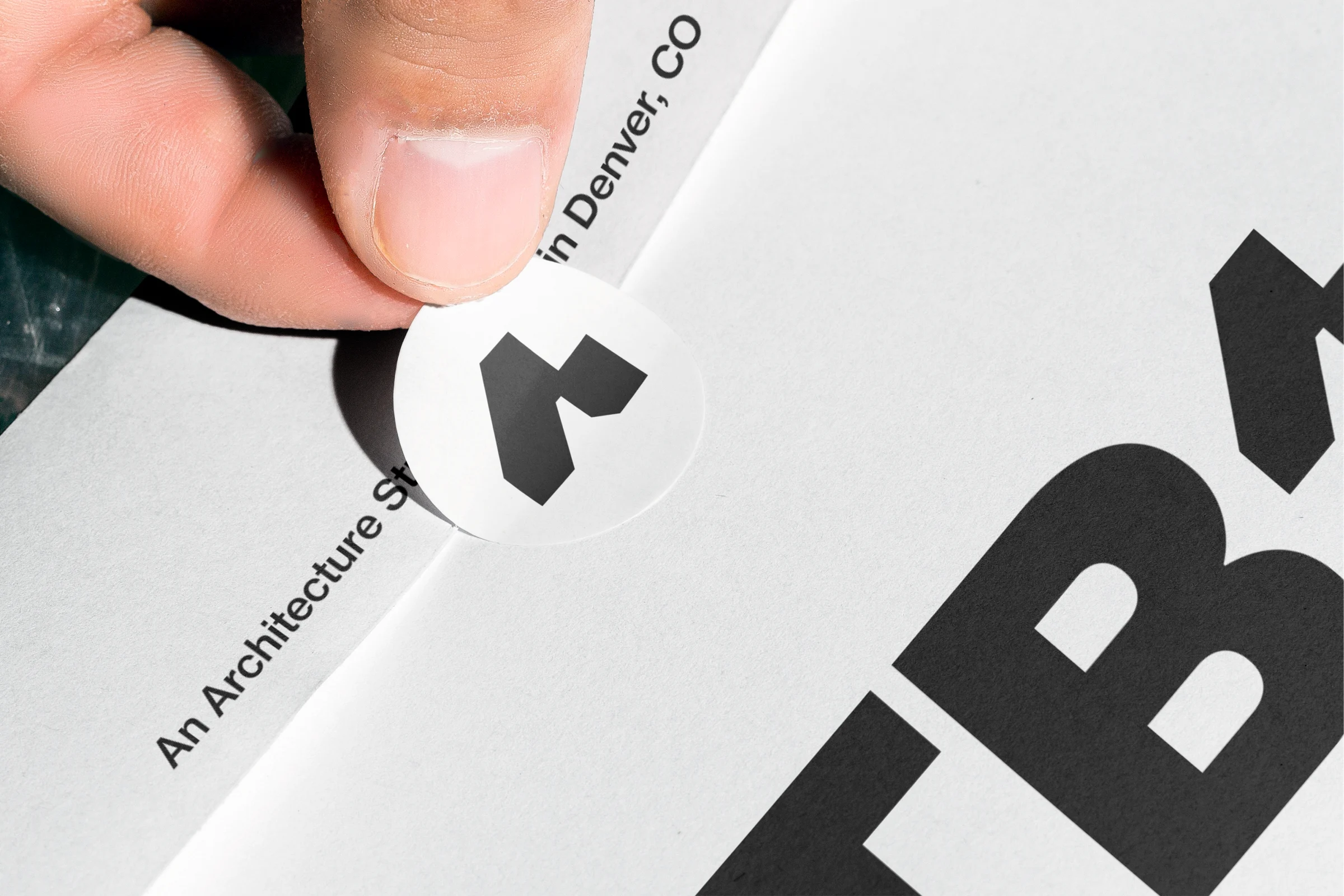 Close-up of the standalone A symbol on a sticker with the proposed LTBa wordmark.
