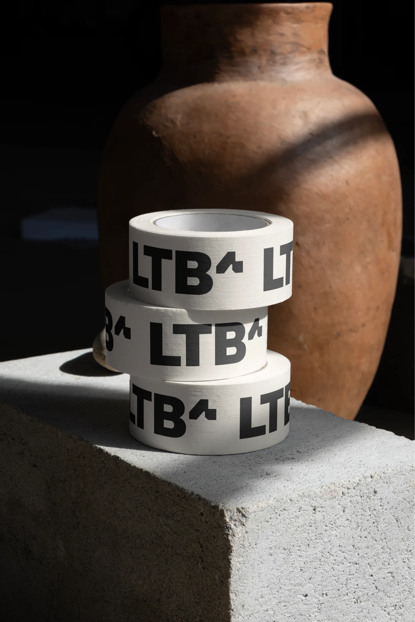 Proposed LTBa wordmark repeated on rolls of printed tape.
